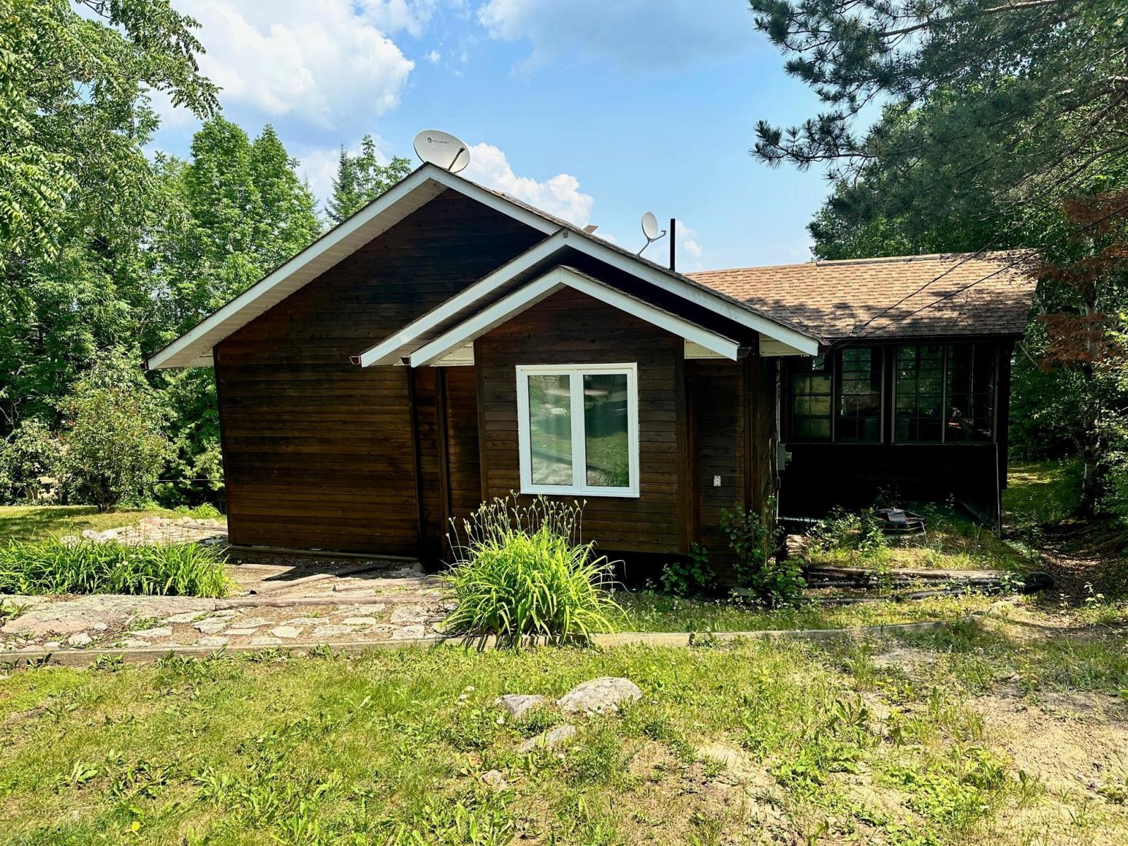 Big Whiteshell Lakefront Cottage for Sale with Sand Beach